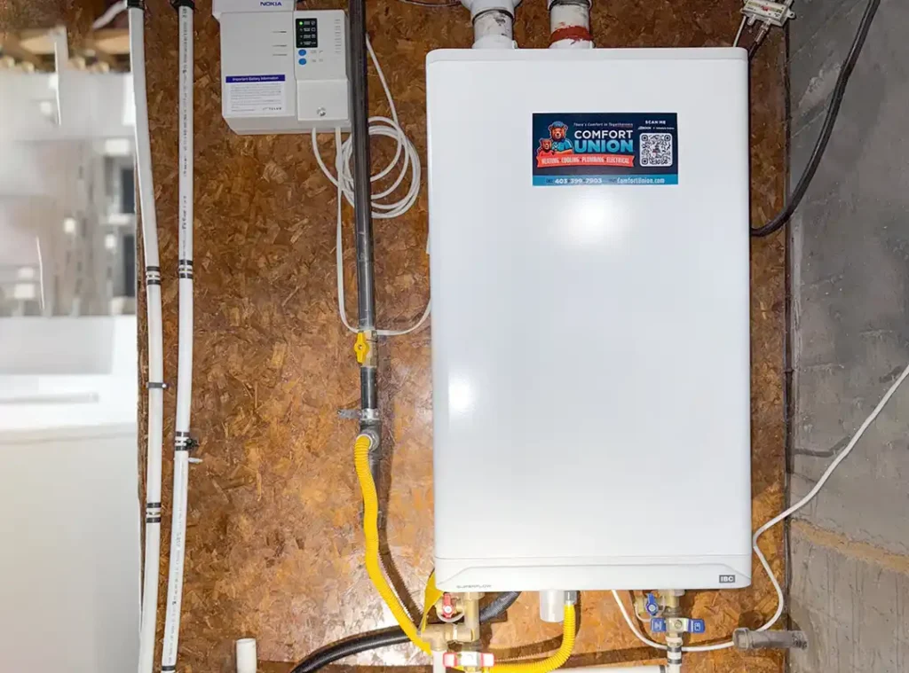 IBC Superflow tankless water heater installed by Comfort Union in a residential utility room