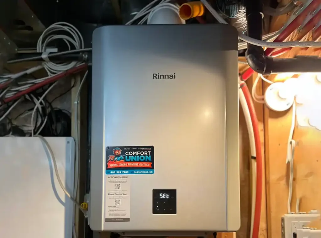 Installed Rinnai tankless water heater with visible plumbing and installation work by Comfort Union