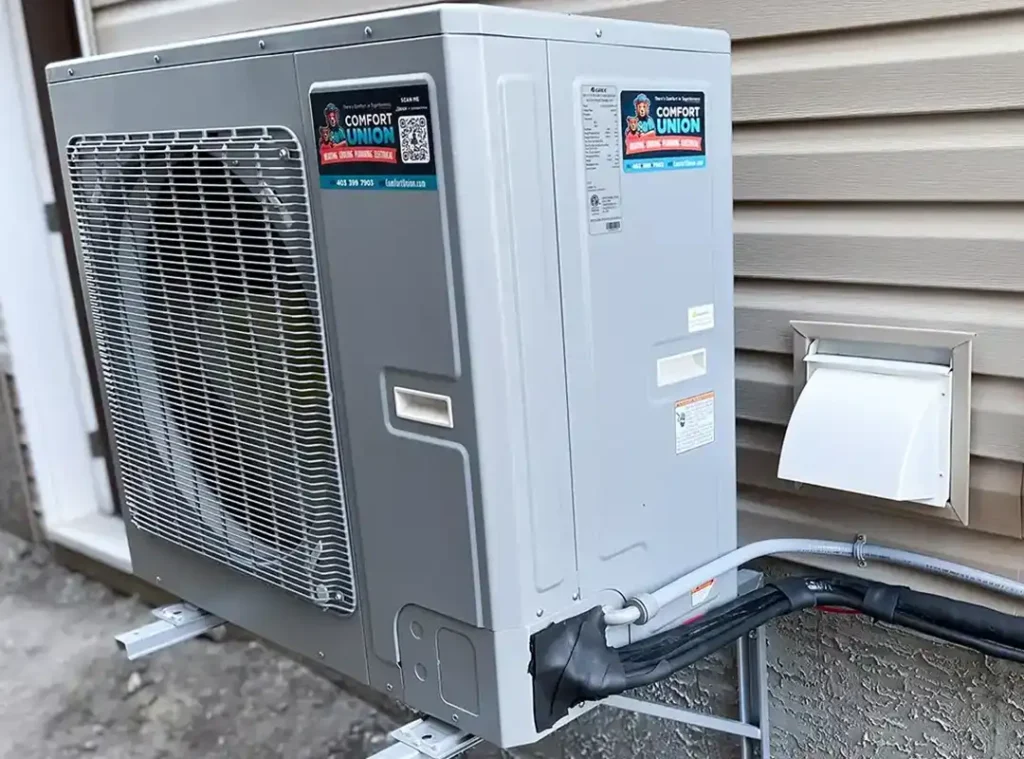 Installed heat pump unit positioned outside a Calgary home, professionally set up by Comfort Union
