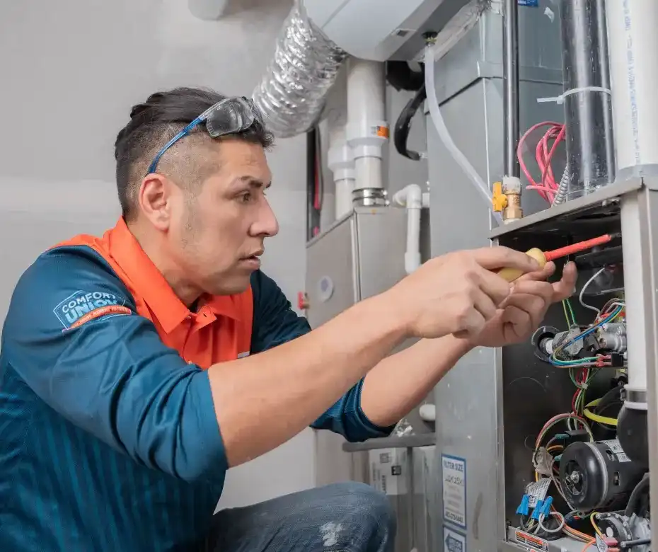 comfort union technician maintaining HVAC system