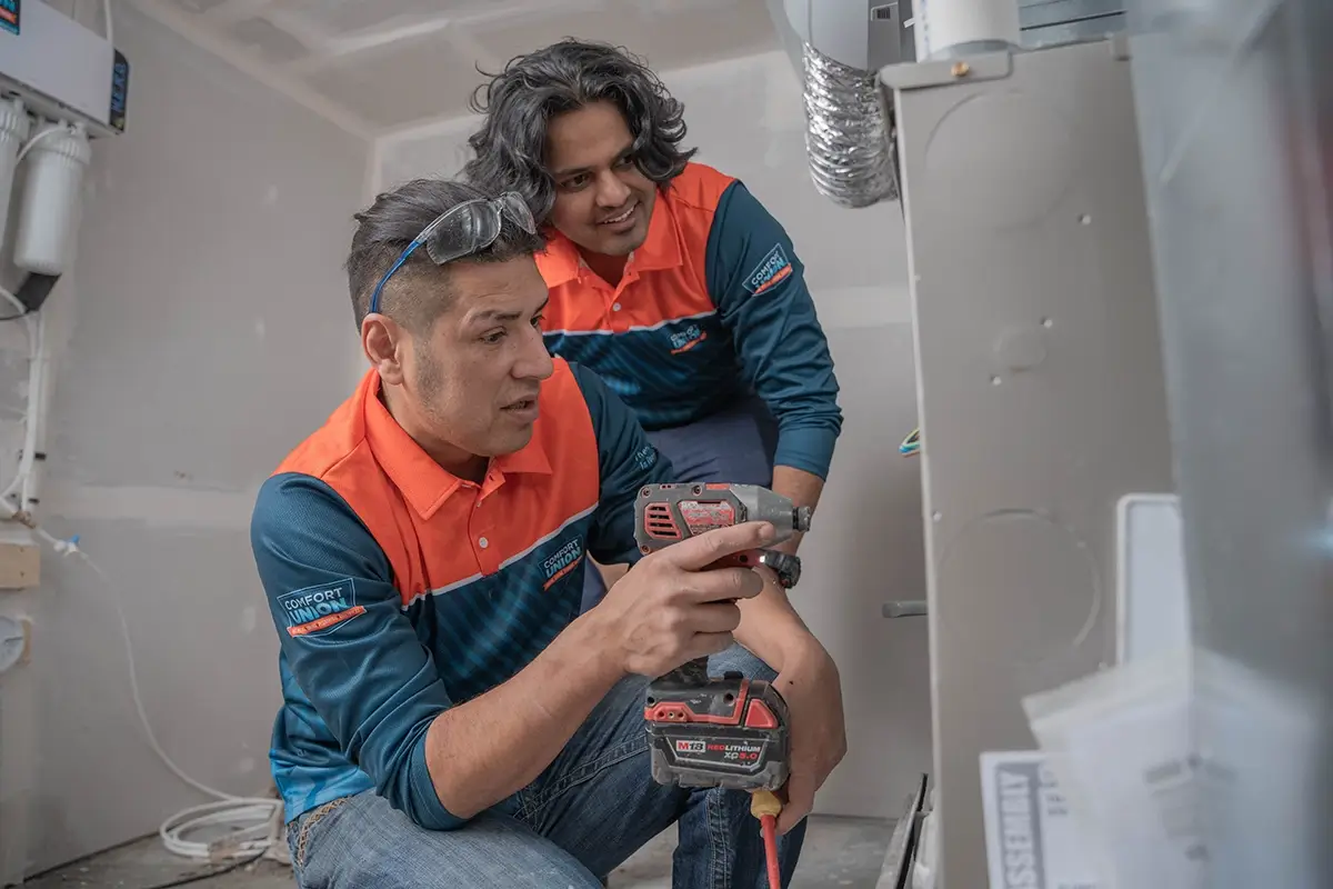 comfort union team installing heat pump in calgary