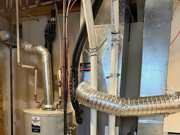 Carrier furnace installed by the Comfort Union team, proudly shown by the client after installation.