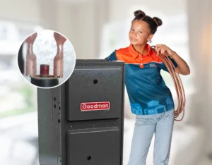Showing the reset button on a Goodman furnace inside a Calgary home