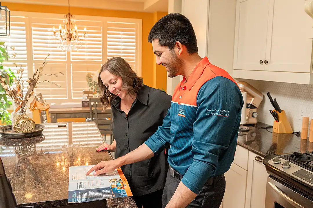 Comfort Union representative helping homeowner with HVAC service plan