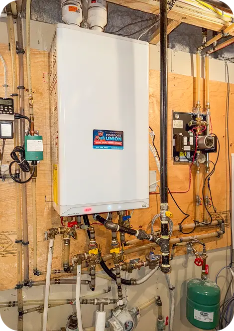 Comfort Union heating experts installing residential boiler