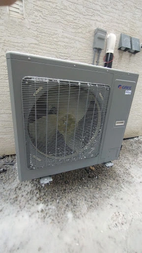 Comfort Union HVAC installing outdoor heat pump system in Calgary residence