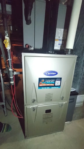Carrier heat pump installed outside Calgary home by Comfort Union HVAC experts