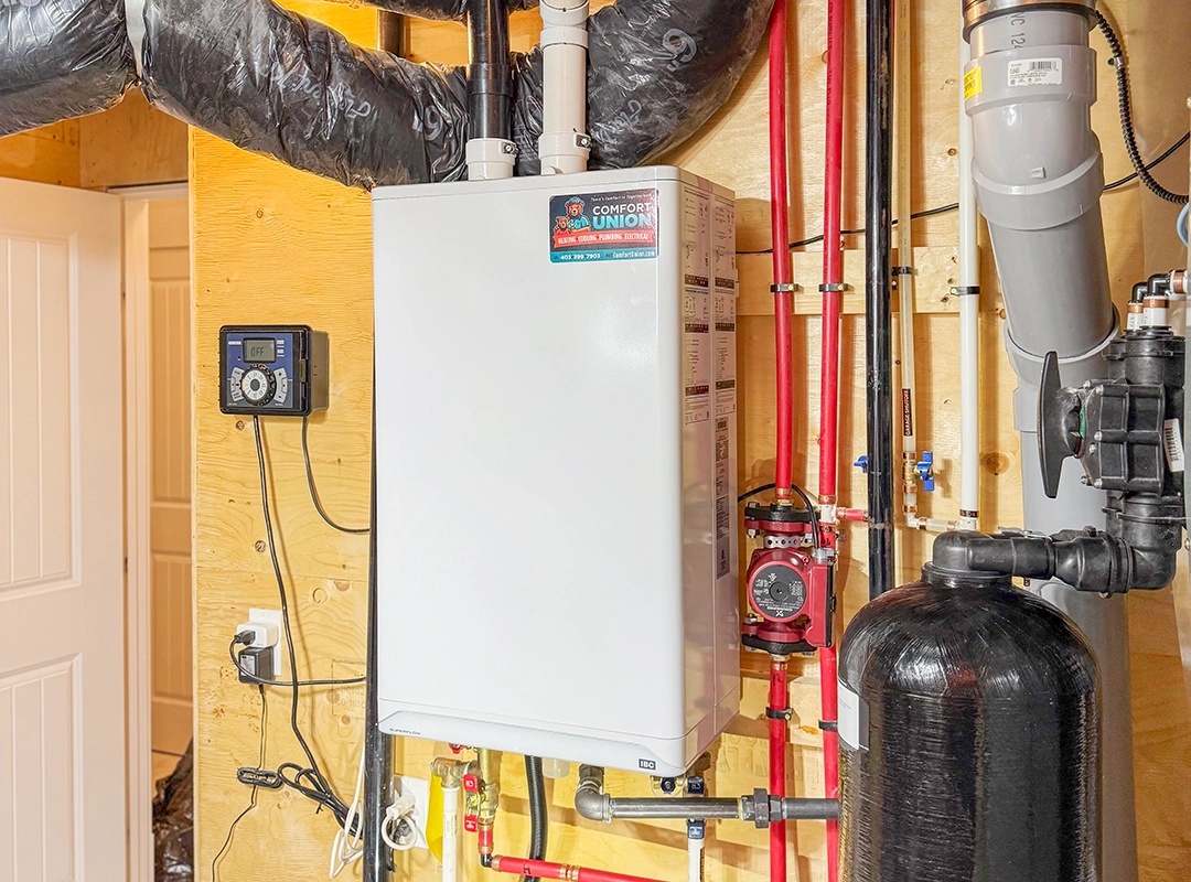 Wall-mounted IBC boiler installed by Comfort Union technician in Calgary