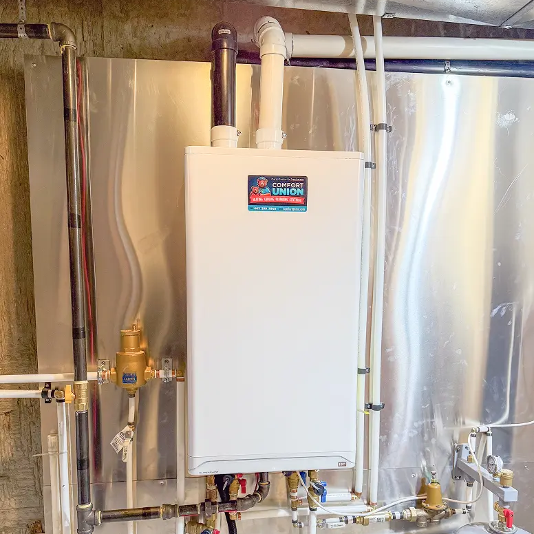 New high-efficiency boiler installed by Comfort Union technician in a Calgary residence.