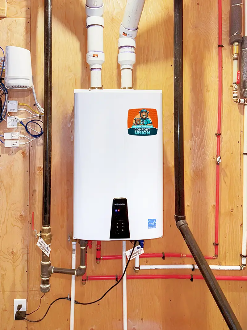 Energy-efficient tankless water heater setup by Comfort Union Calgary