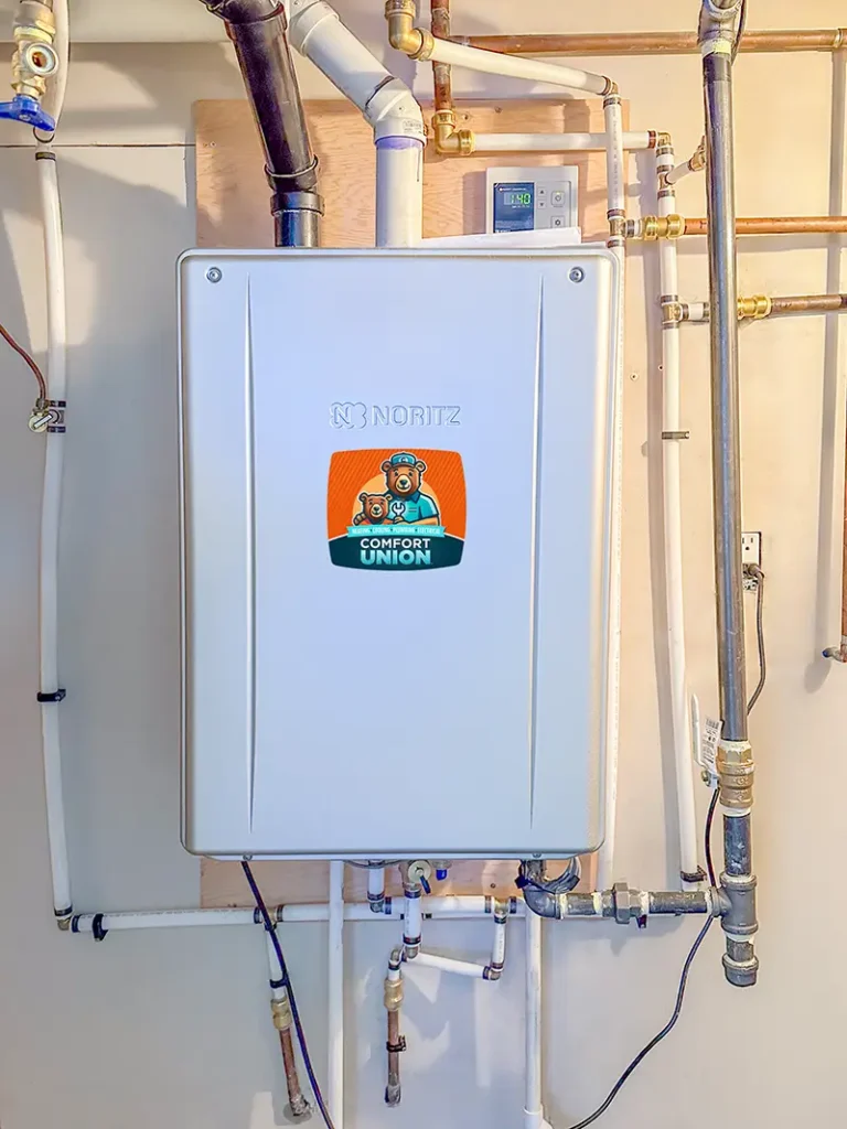 Modern on-demand tankless water heater installed in Calgary by Comfort Union