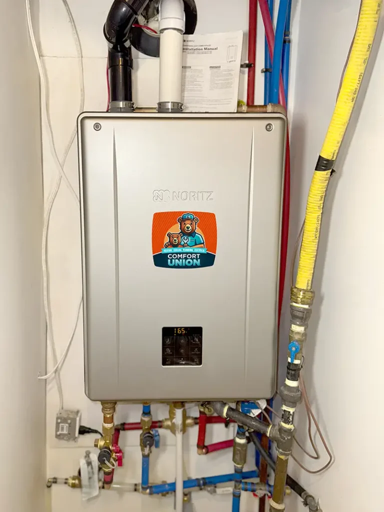 Compact tankless water heating unit installed in Calgary home