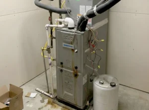 Calgary homeowner reviewing furnace installation with technician