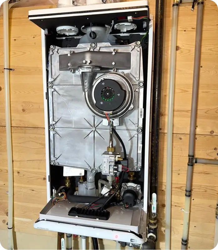 IBC boiler internal components exposed during professional repair service in Calgary by Comfort Union