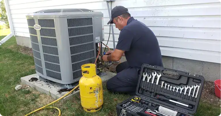 Comfort Union technician servicing an outdoor AC unit installation in Calgary, Alberta
