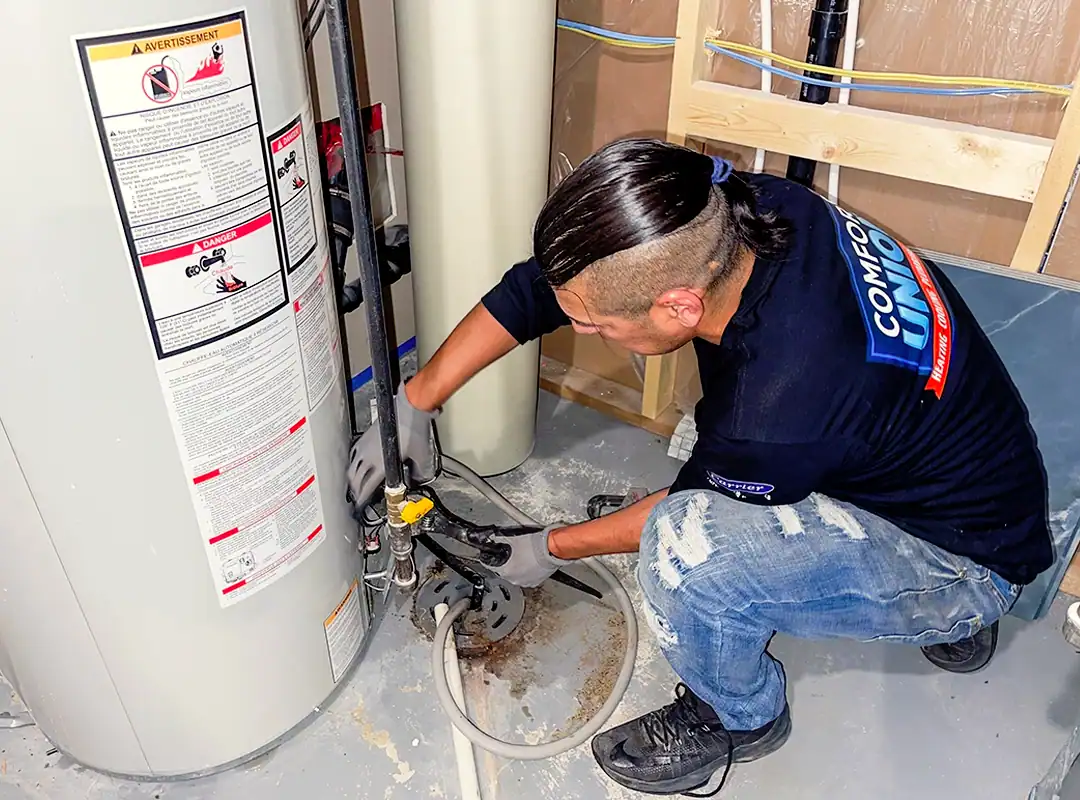 Comfort Union technician performing heating maintenance in Calgary